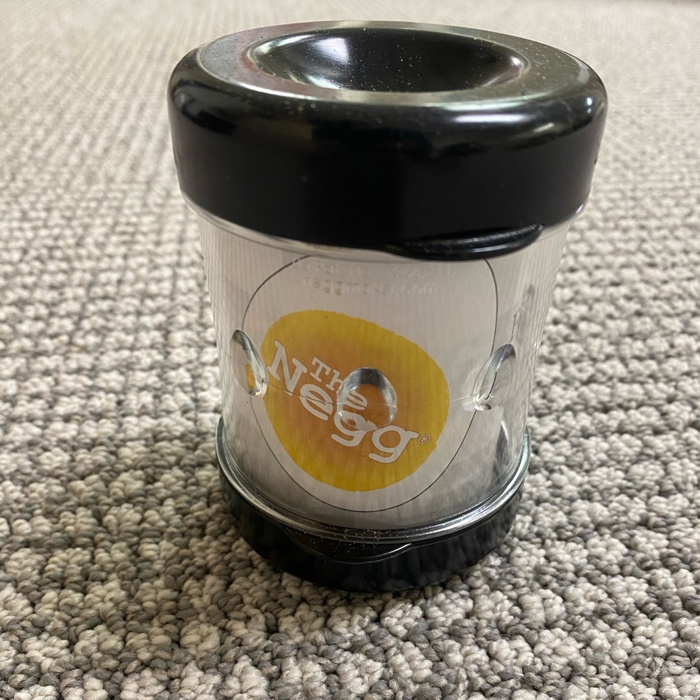 NWOT The Negg Egg  - egg peeler Black and Clear with Logo